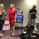 QAnon conspiracy theorist Marjorie Taylor Greene, seen in red, at an election event at Rome, Georgia in August 2020.